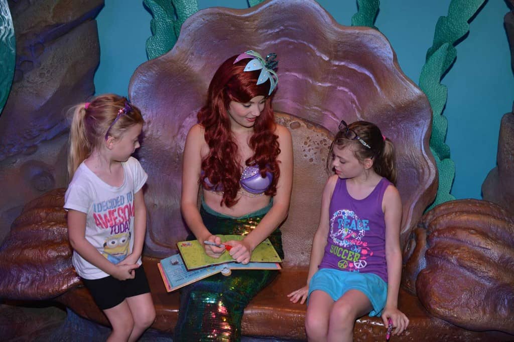 little girls visiting the little mermaid at disney world